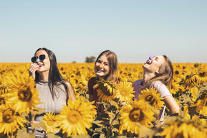 Group of girls wearing colorful variations of Nöz zinc oxide sunscreens